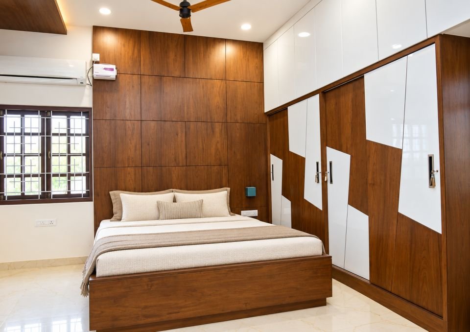 Bedroom with wood headboard wall and patterned wardrobe