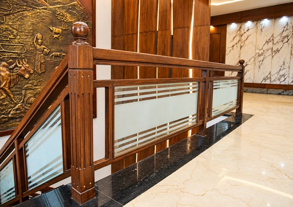 Stair landing with wood and glass railing