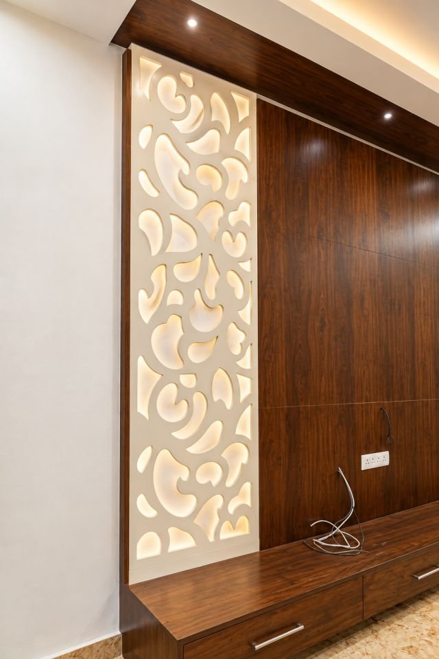 TV wall with a backlit cut-pattern panel
