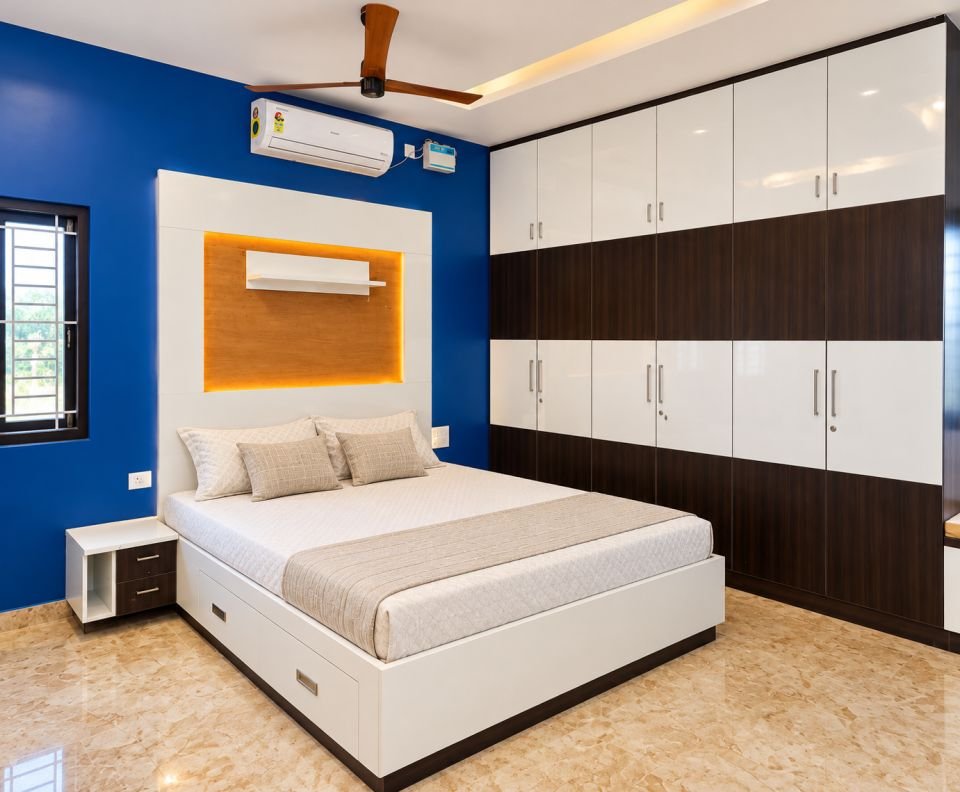 Bedroom with blue accent wall and full-height wardrobe