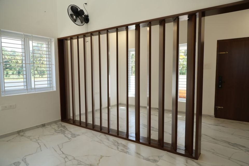 Wooden slat partition beside the window