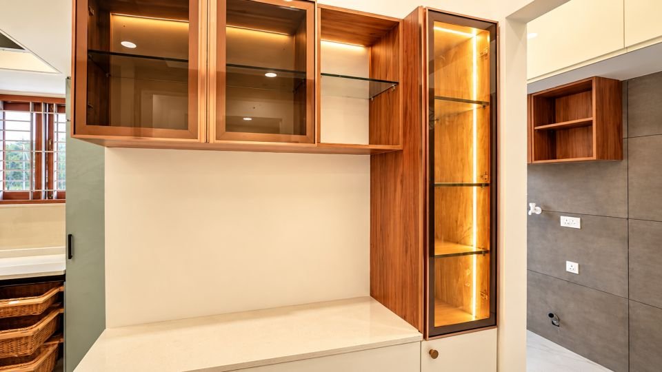 Crockery unit with glass shutters and warm lighting