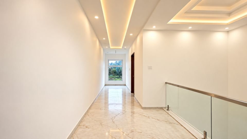 First floor passage with cove lighting