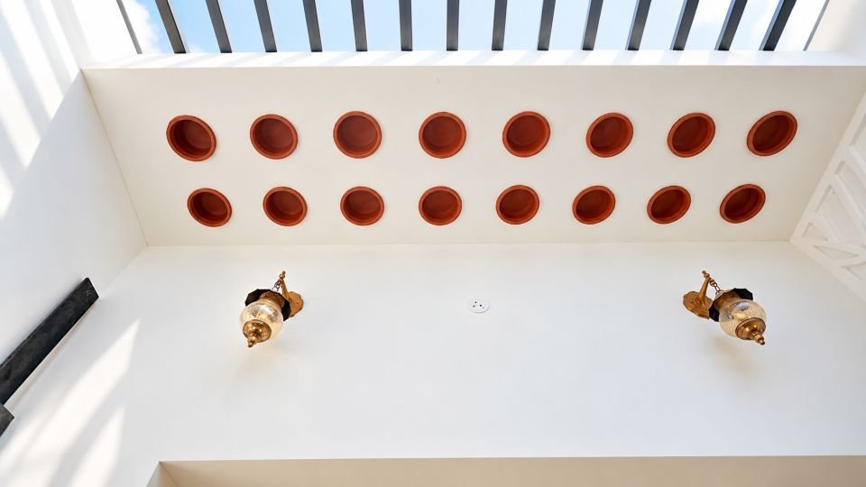 Courtyard skylight with hanging lamps