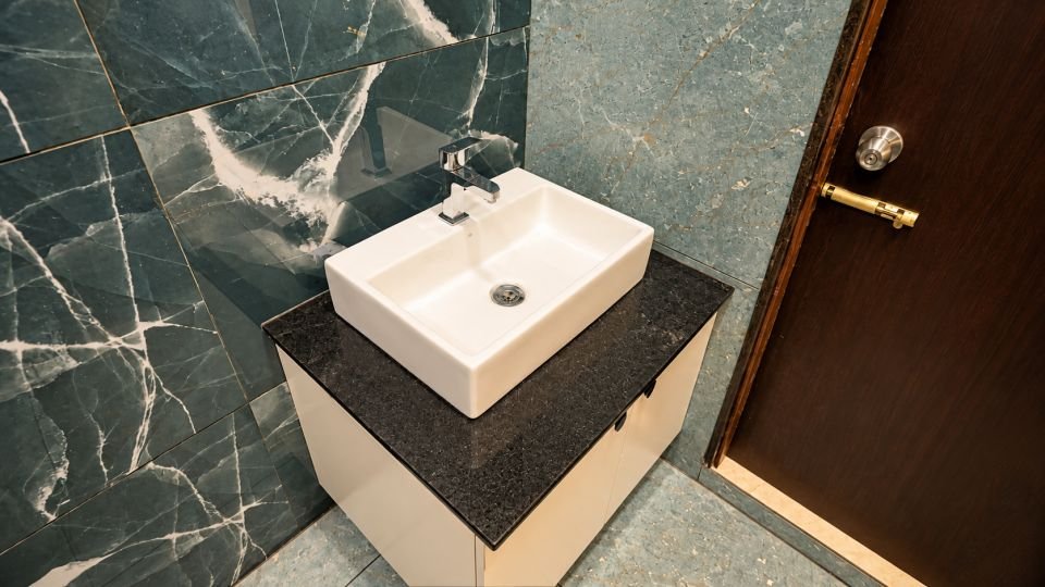 Wash basin on dark counter